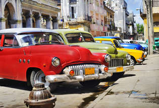 detail of colorful group of vintage american cars parked in a street of old havana_315_215